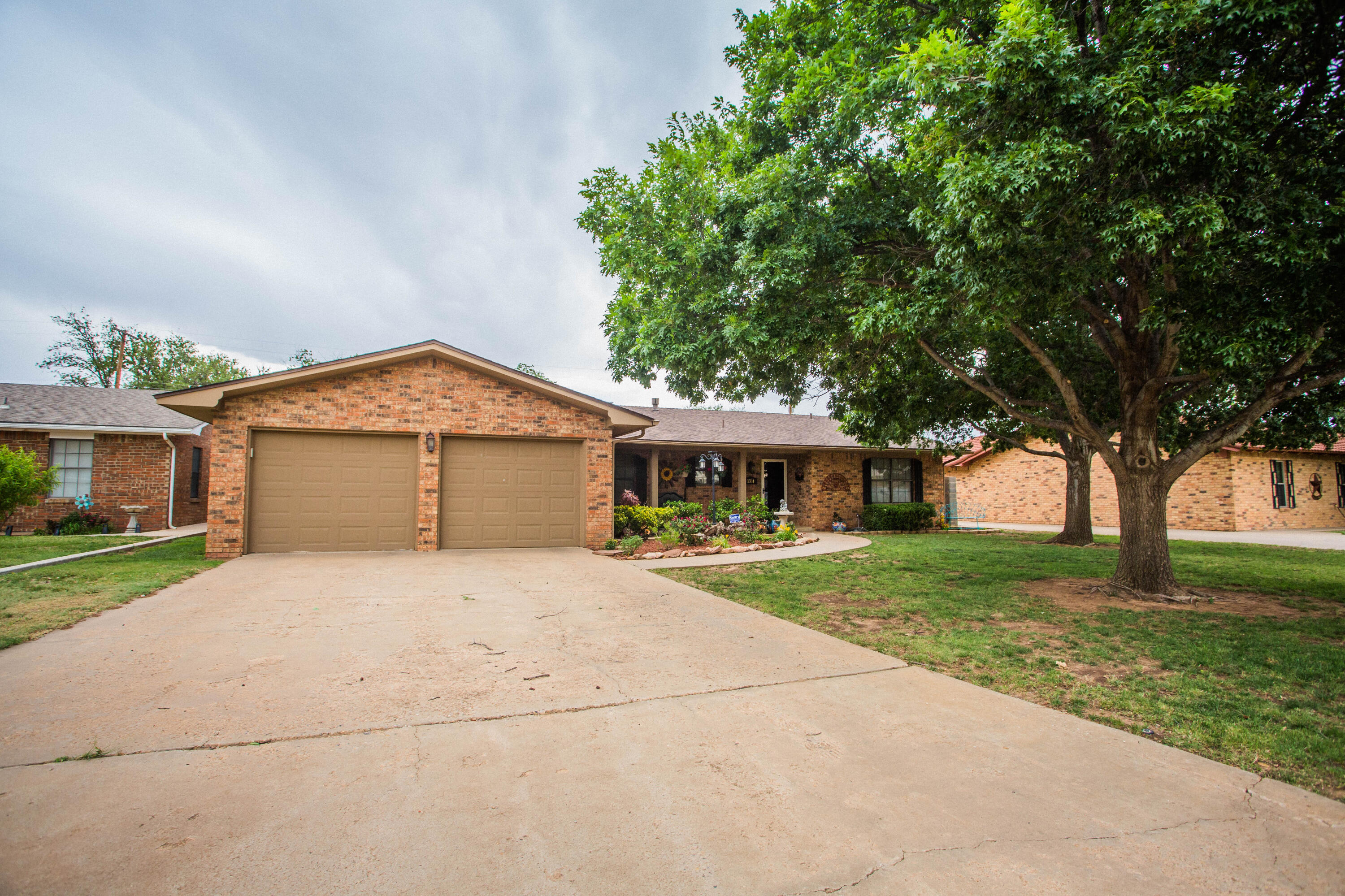 1304 Jefferson Drive Plainview, TX 79072 - Photo 1 of 50 a front view of a house with yard