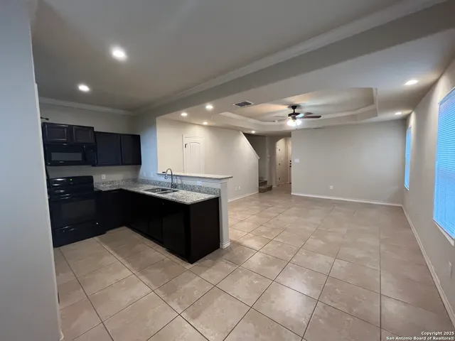 a view of a hallway with a chandelier