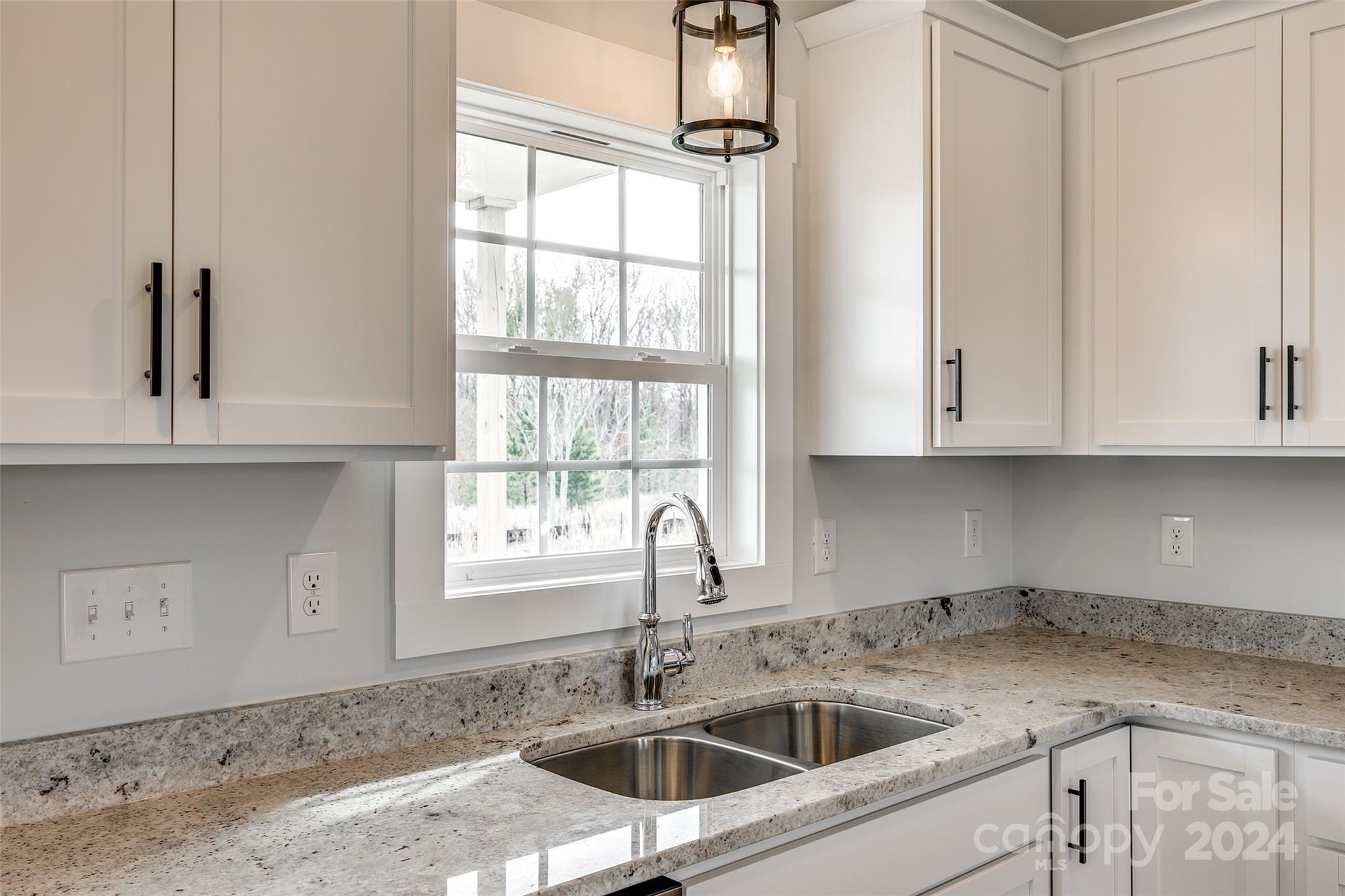 1186 Philbeck Road York, SC 29745 - Photo 12 of 35 a kitchen with stainless steel appliances granite countertop a sink a window and cabinets