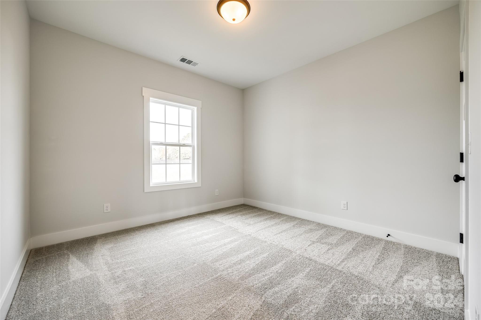 1186 Philbeck Road York, SC 29745 - Photo 14 of 35 an empty room with windows and