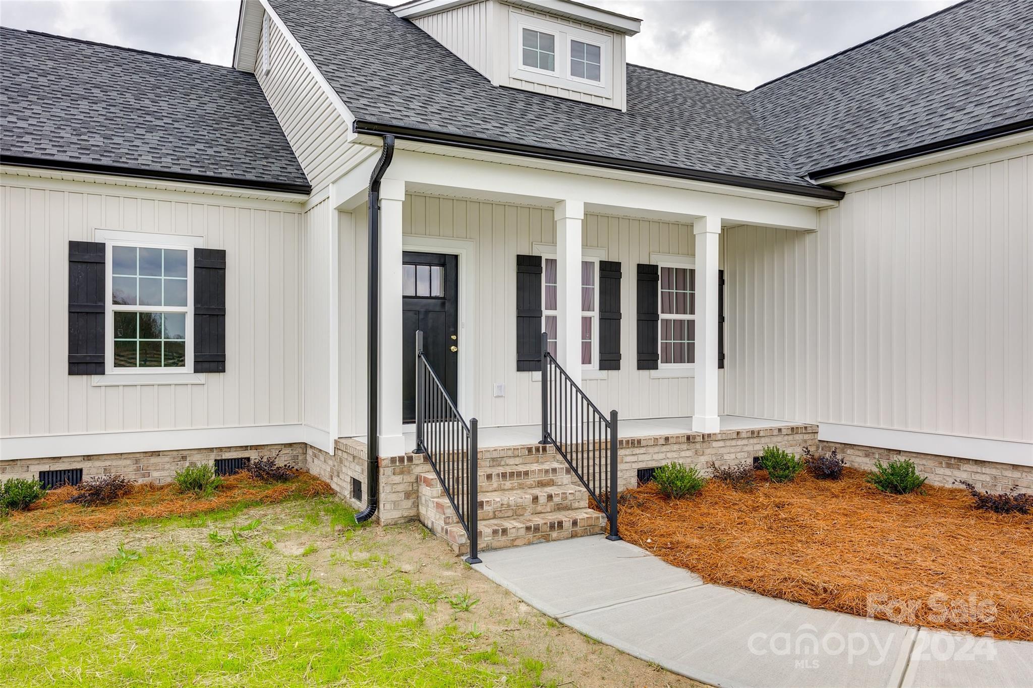 1186 Philbeck Road York, SC 29745 - Photo 2 of 35 a front view of a house with a swimming pool