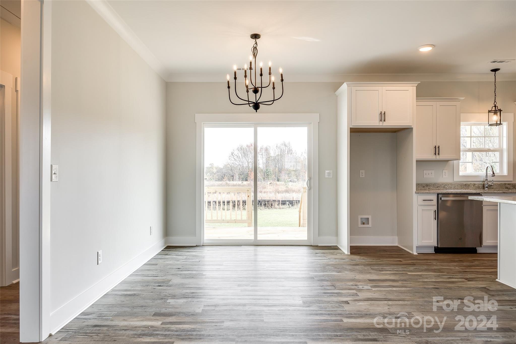 1186 Philbeck Road York, SC 29745 - Photo 8 of 35 a view of an empty room with window and wooden floor
