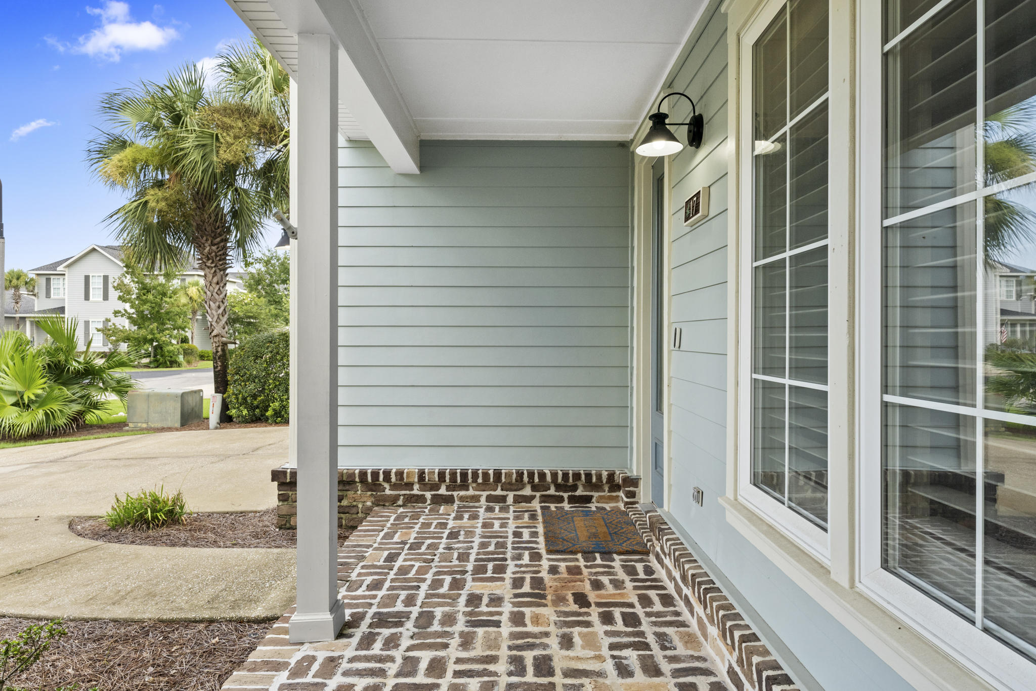 17 South Zander Way Santa Rosa Beach, FL 32459 - Photo 3 of 44 a view of a door with a potted plant and a window