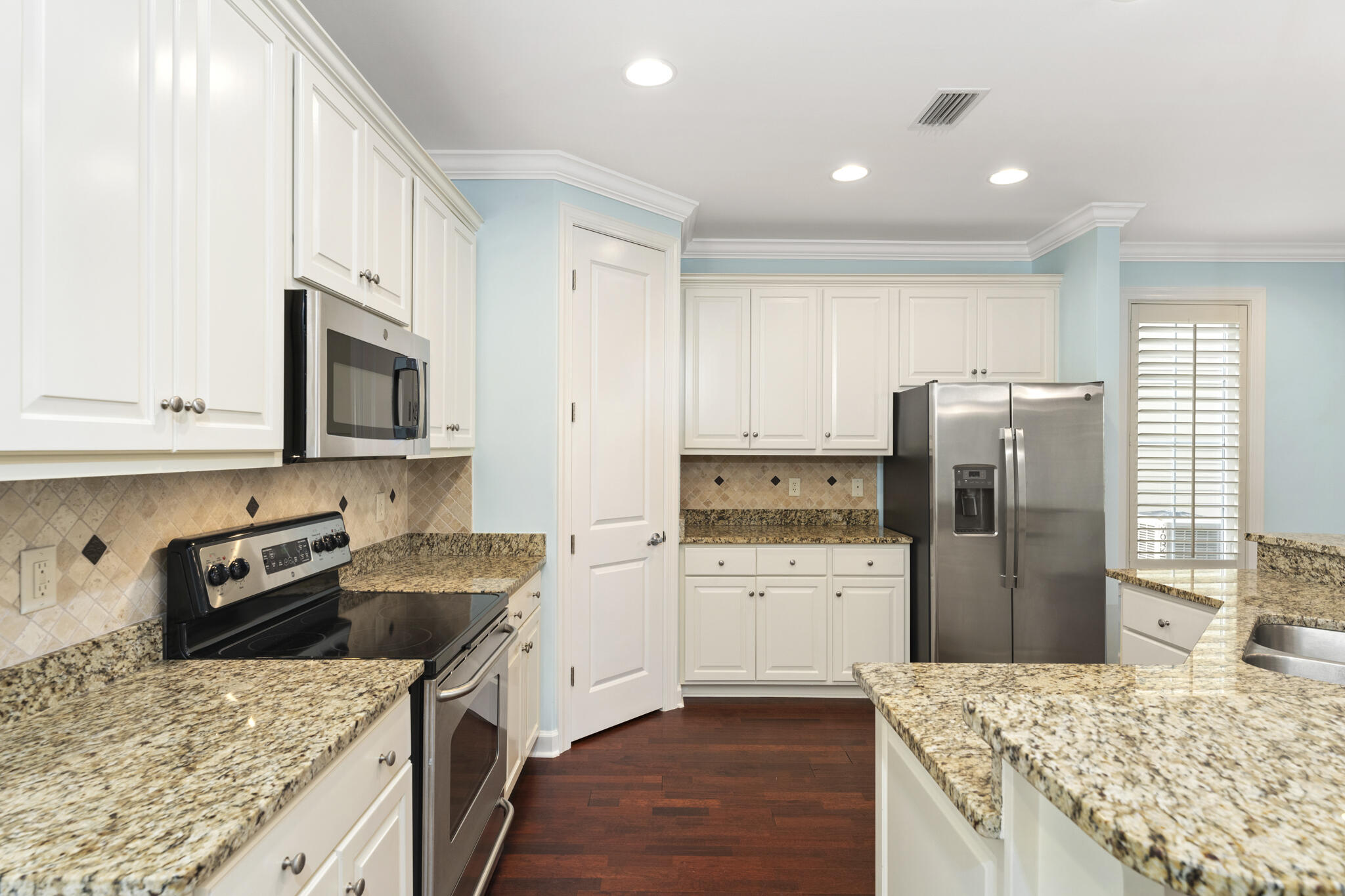 17 South Zander Way Santa Rosa Beach, FL 32459 - Photo 10 of 44 a kitchen with a refrigerator stove and sink