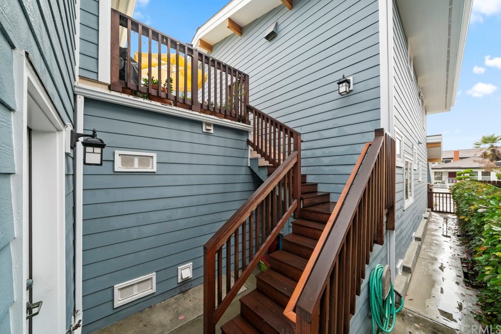 218 14th Street Seal Beach, CA 90740 - Photo 30 of 44 Rear separate entrance to upstairs 2 bedroom 2 bath rental unit