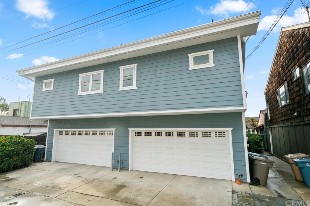 218 14th Street Seal Beach, CA 90740 - Photo 40 of 44 View from the alley of Apartment over the 2 double car garages. Lots of extra parking on the pad