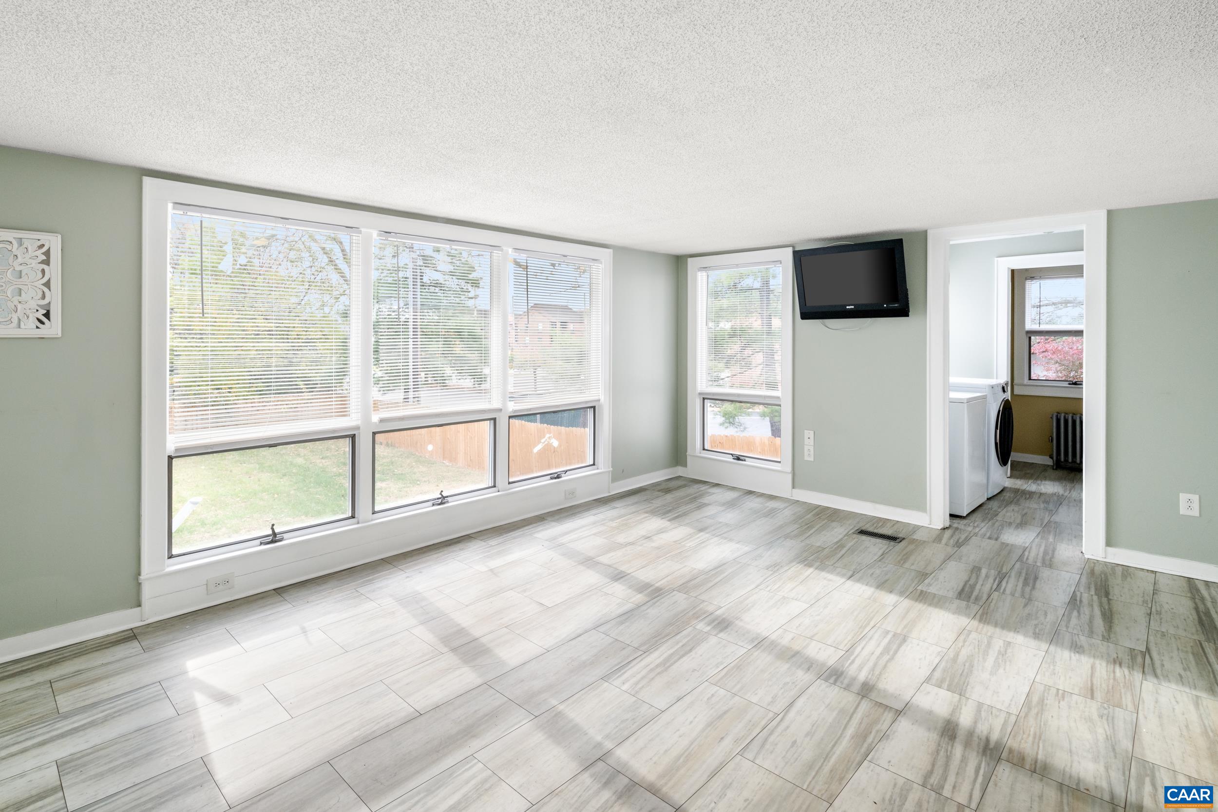 21 Port Republic Road Harrisonburg, VA 22801 - Photo 15 of 69 a view of an empty room with a window and a kitchen