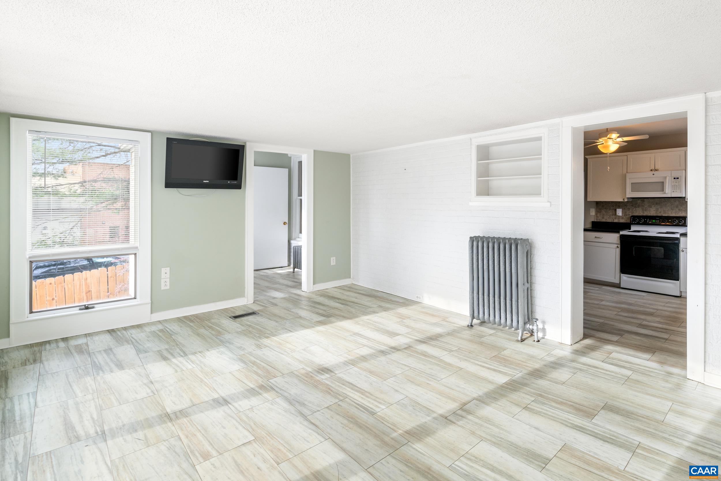 21 Port Republic Road Harrisonburg, VA 22801 - Photo 16 of 69 a view of empty room with wooden floor and fan