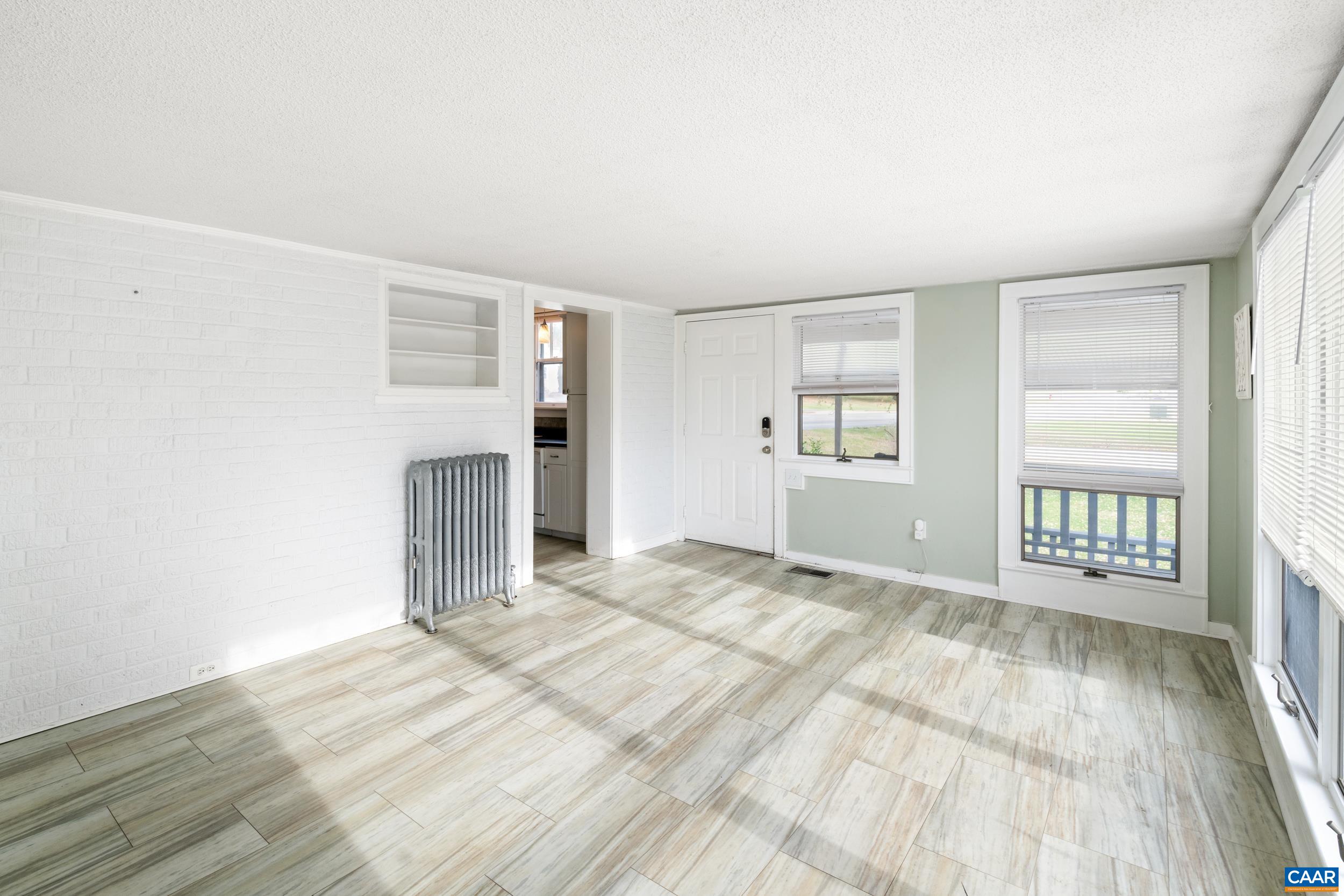 21 Port Republic Road Harrisonburg, VA 22801 - Photo 17 of 69 a view of empty room with wooden floor and fan