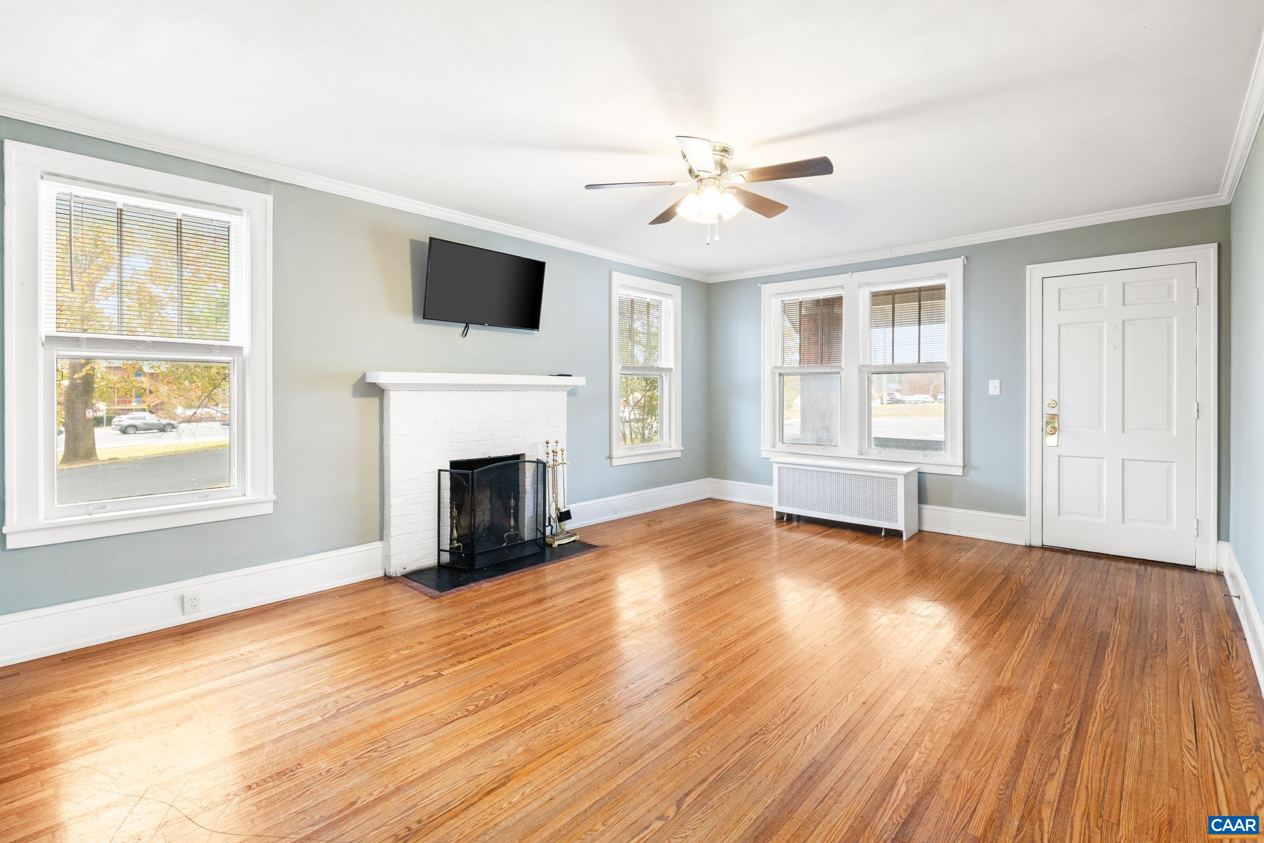 21 Port Republic Road Harrisonburg, VA 22801 - Photo 2 of 69 a view of a livingroom with a fireplace wooden floor and windows