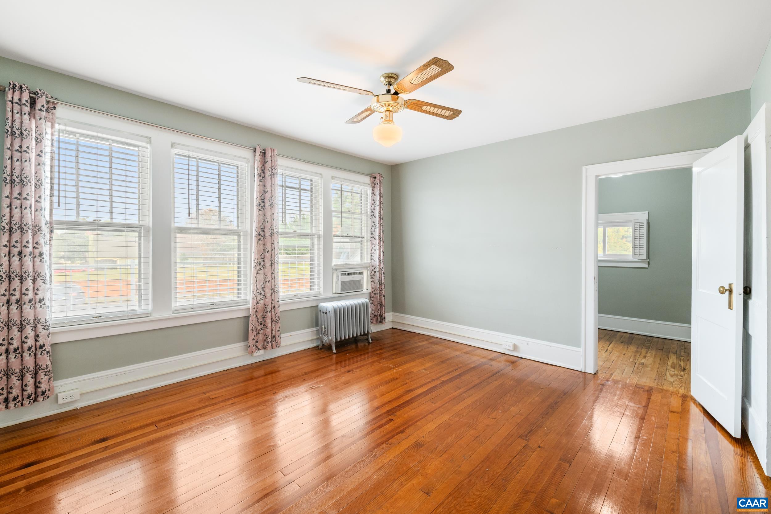 21 Port Republic Road Harrisonburg, VA 22801 - Photo 25 of 69 a view of an empty room with a window and wooden floor