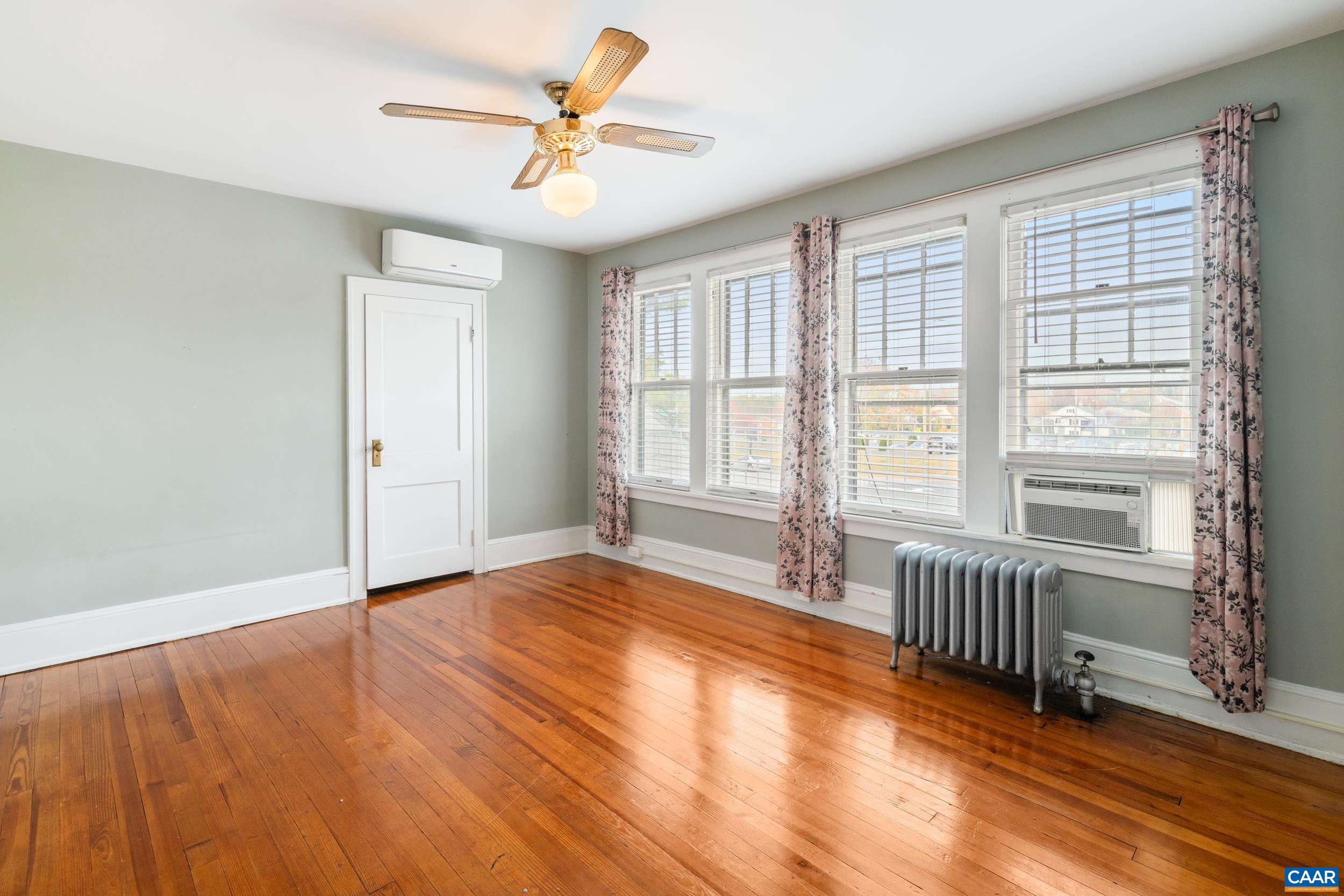 21 Port Republic Road Harrisonburg, VA 22801 - Photo 26 of 69 wooden floor in an empty room with a window