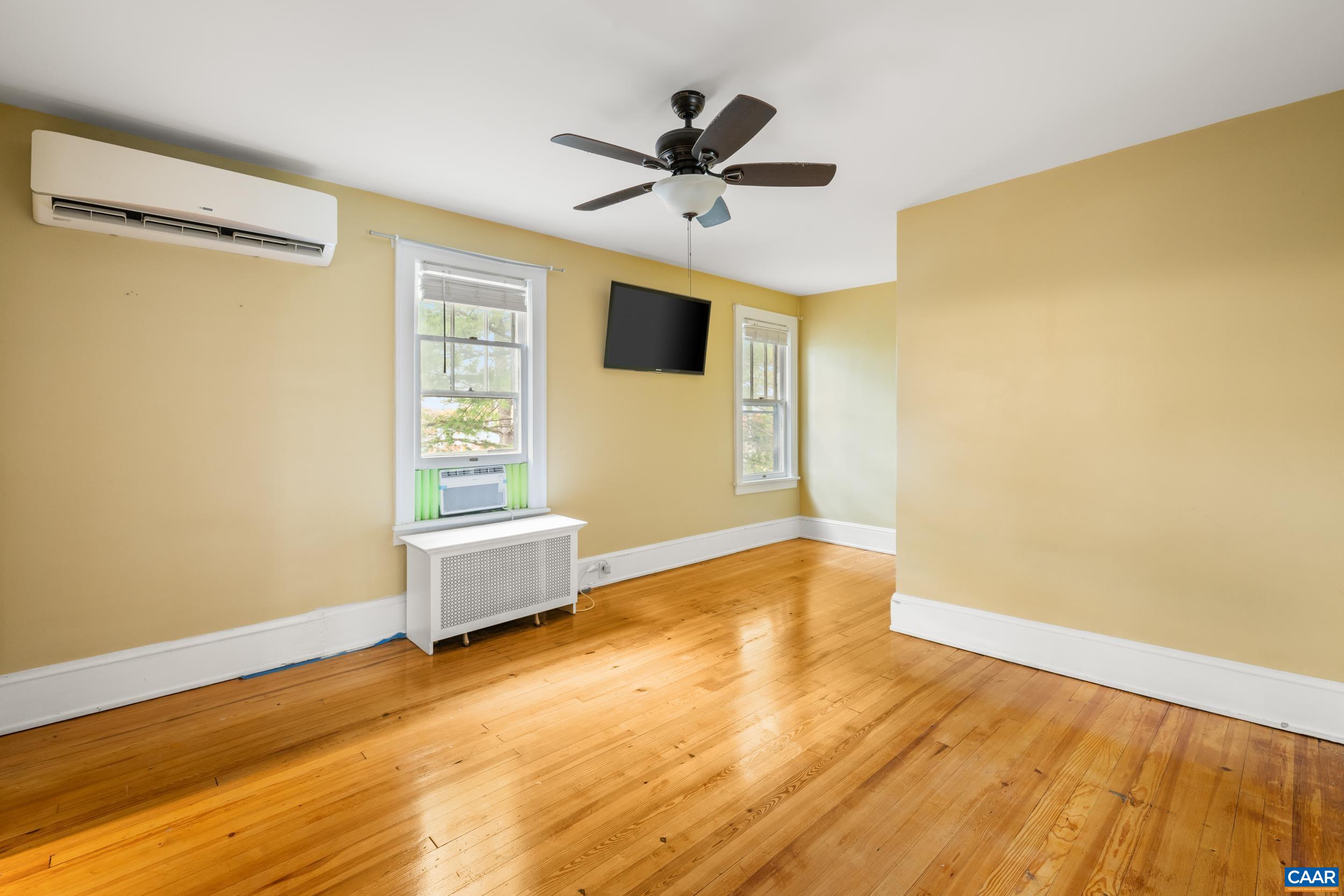 21 Port Republic Road Harrisonburg, VA 22801 - Photo 29 of 69 a view of an empty room with wooden floor and a window