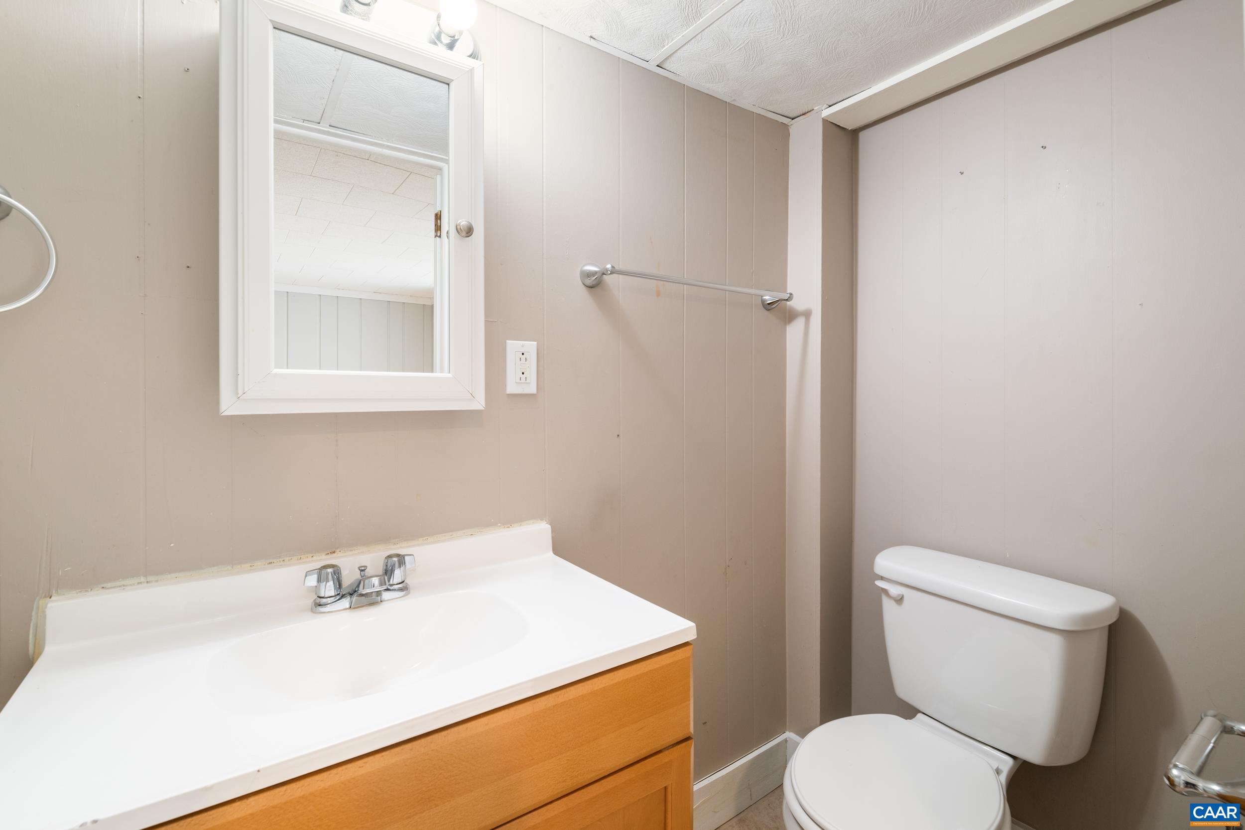 21 Port Republic Road Harrisonburg, VA 22801 - Photo 46 of 69 a bathroom with a toilet sink and mirror