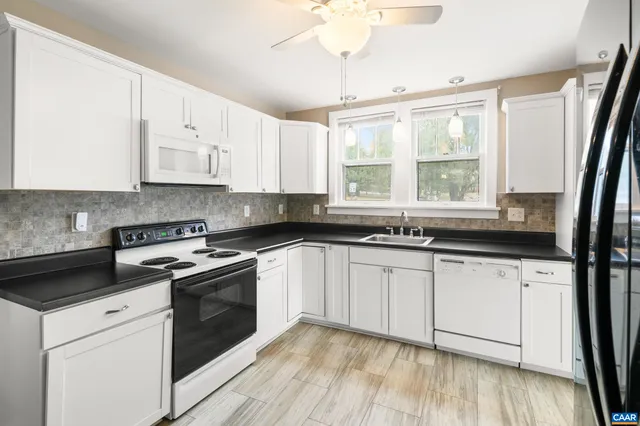 a kitchen with stainless steel appliances a refrigerator and a sink