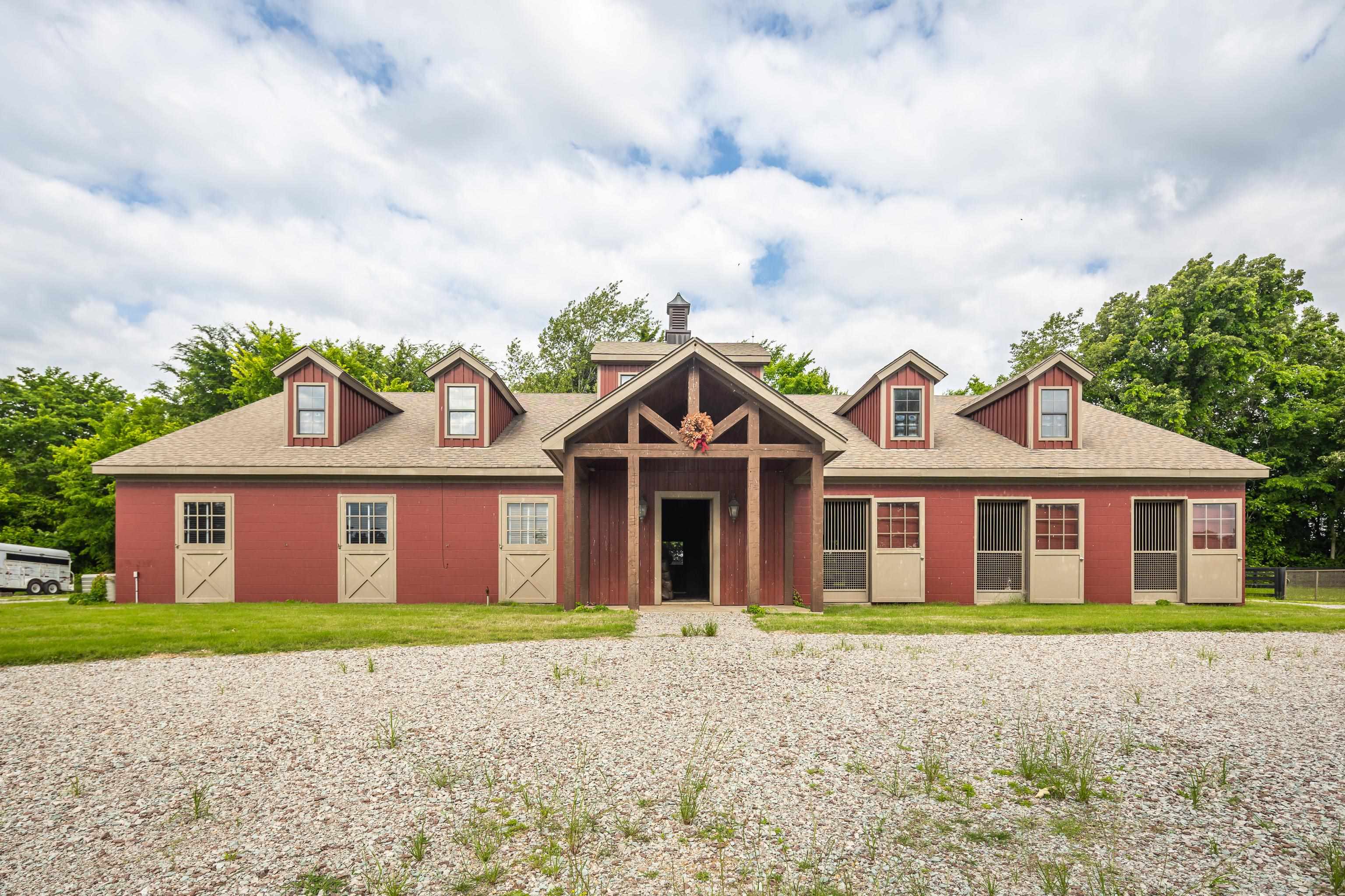 6085 Yum Yum Road Somerville, TN 38068 - Photo 33 of 40 a front view of a house with a garden and trees