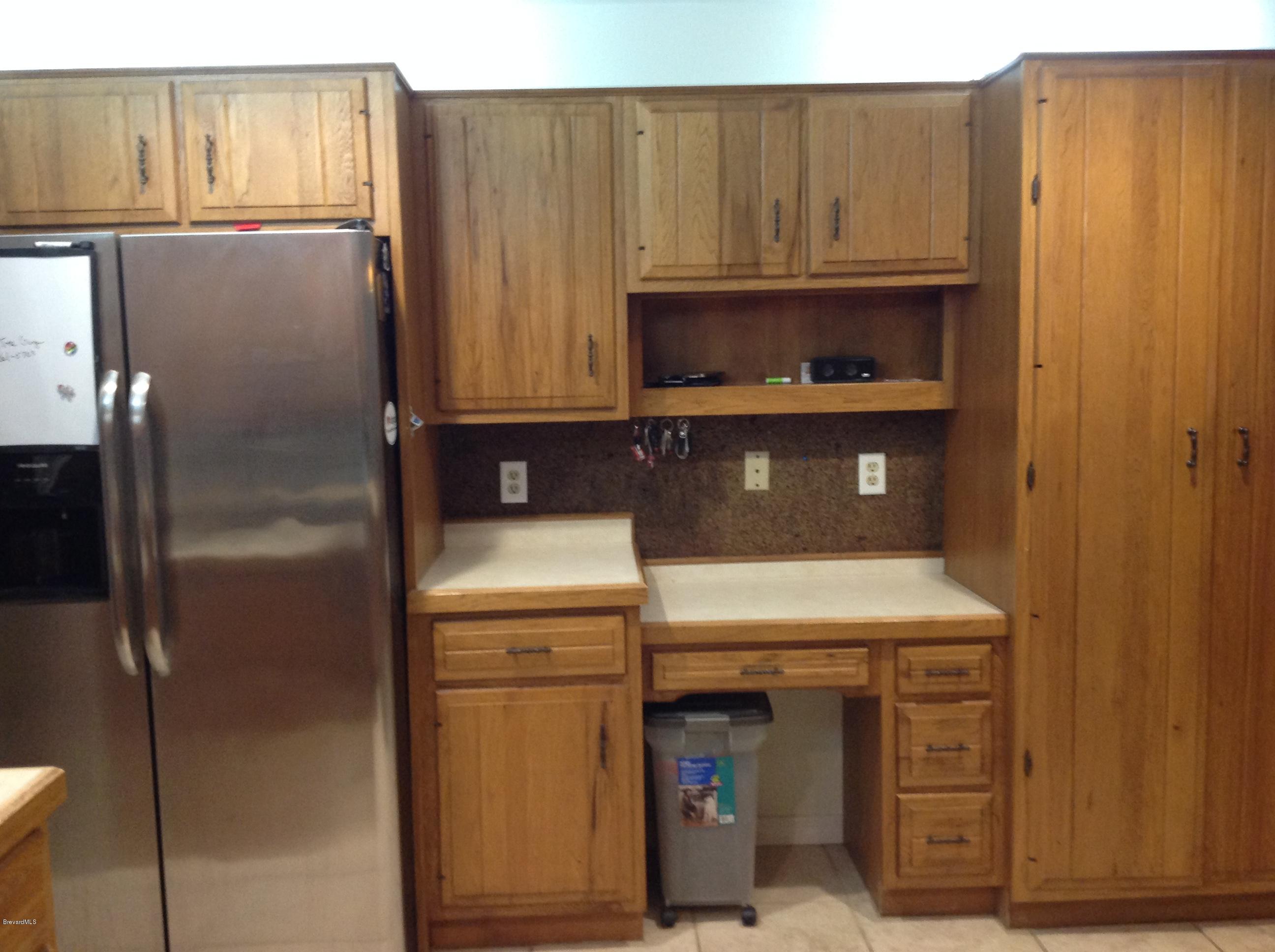 3082 Rio Bonita Street Melbourne, FL 32903 - Photo 8 of 27 Stainless appliances and chefs desk