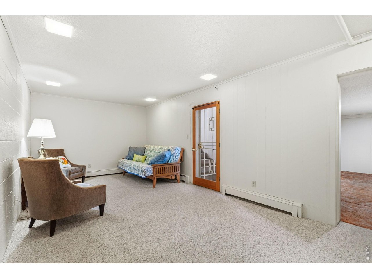 1909 Turnberry Road Fort Collins, CO 80524 - Photo 27 of 50 Basement rec room with separate entrance to outdoors