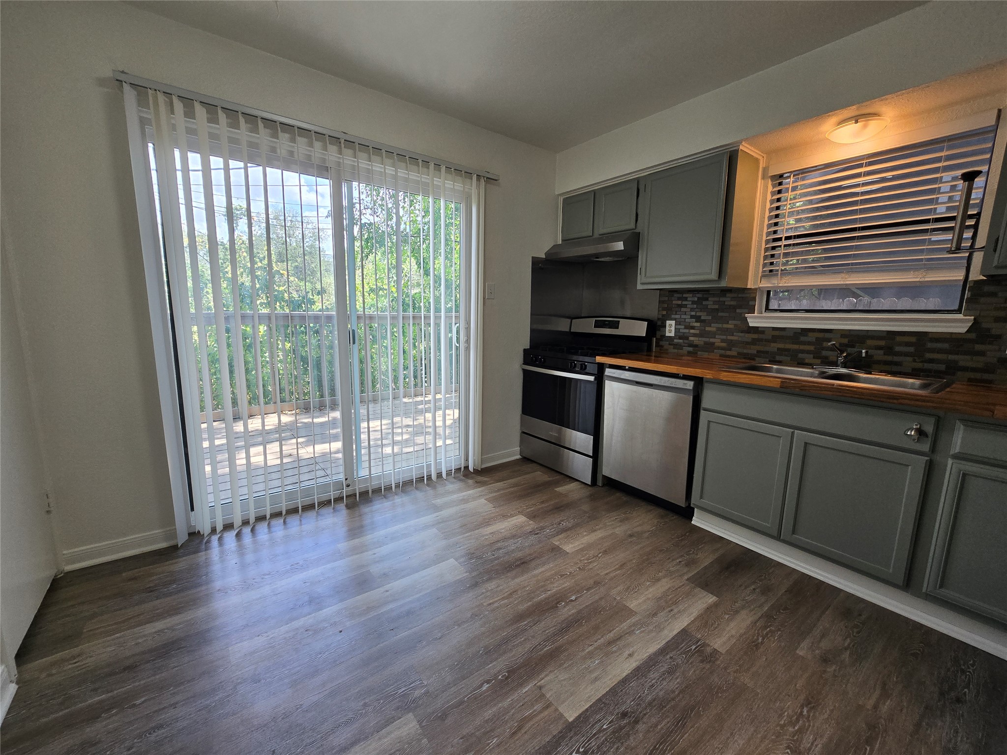 2003 Kenneth Avenue, Unit B Austin, TX 78741 - Photo 6 of 19 Sliding glass doors open to a private deck from this functional kitchen space.