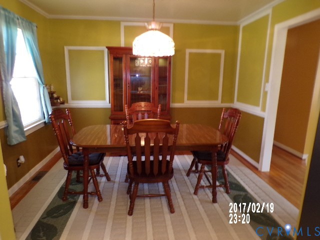 14105 Bethany Church Road Montpelier, VA 23192 - Photo 13 of 20 a view of a dining room with furniture and chandelier