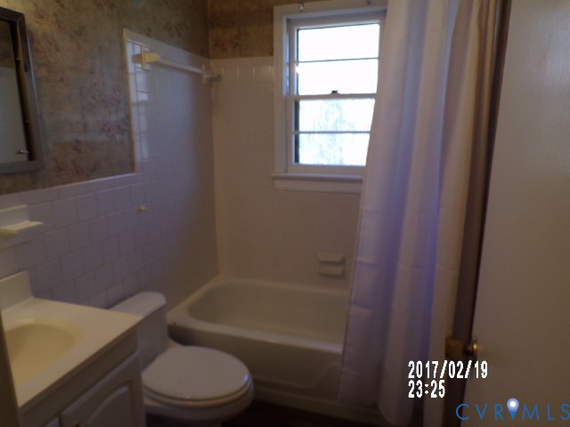 14105 Bethany Church Road Montpelier, VA 23192 - Photo 19 of 20 a bathroom with a toilet and a bathtub