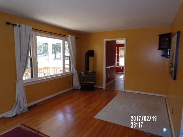 14105 Bethany Church Road Montpelier, VA 23192 - Photo 6 of 20 a view of empty room with wooden floor and fan