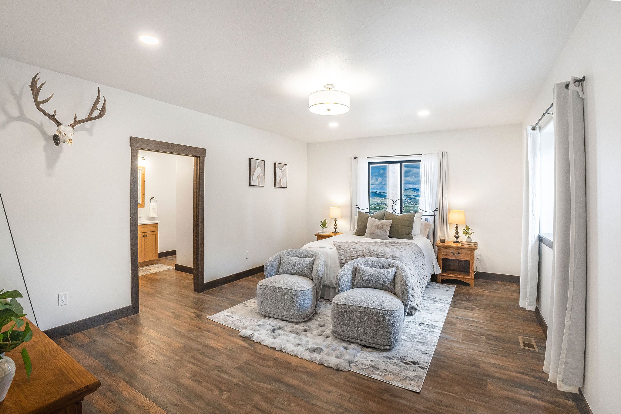 77 Rumsey Road Philipsburg, MT 59858 - Photo 29 of 76 Bedroom featuring dark wood-type flooring, baseboards, recessed lighting, and connected bathroom