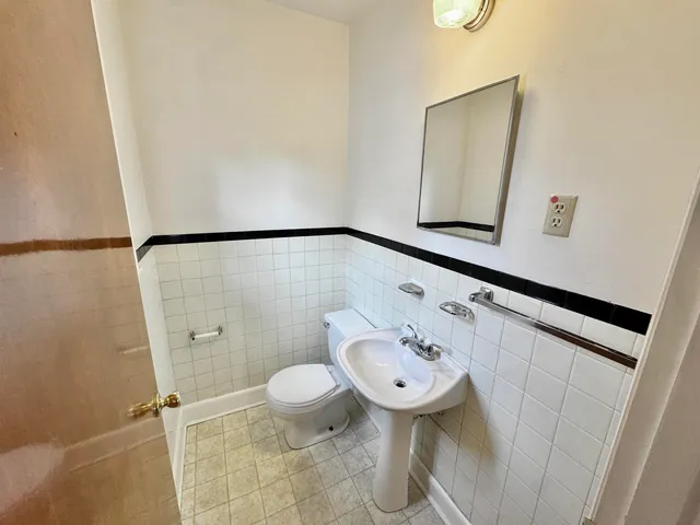 a bathroom with a sink and mirror
