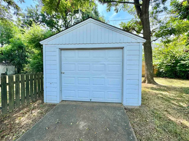 a small barn with a small yard