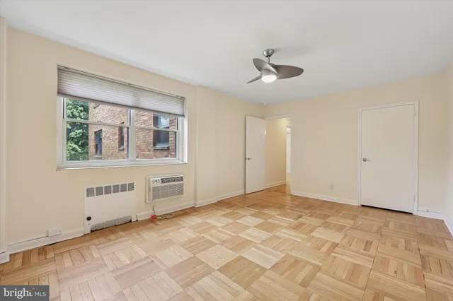 a view of an empty room with a window