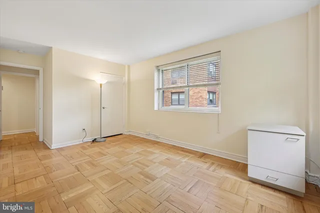 a view of an empty room with a window