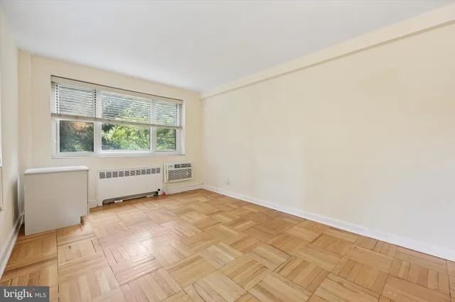 a view of an empty room with a window