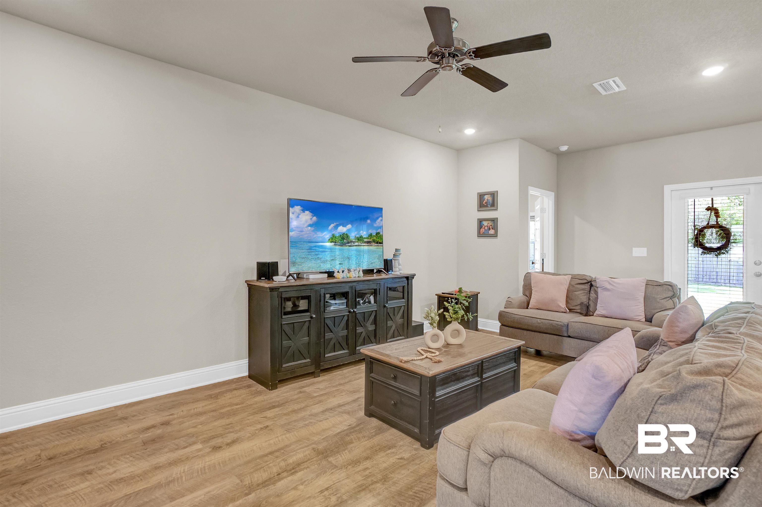 31671 Memphis Loop Daphne, AL 36527 - Photo 17 of 51 Living room with recessed lighting, baseboards, light wood-style floors, visible vents, and a ceiling fan