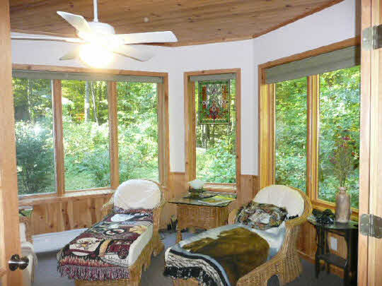 3328 South Seldom Scene Road Oregon, IL 61061 - Photo 8 of 11 a living room with furniture and a large window