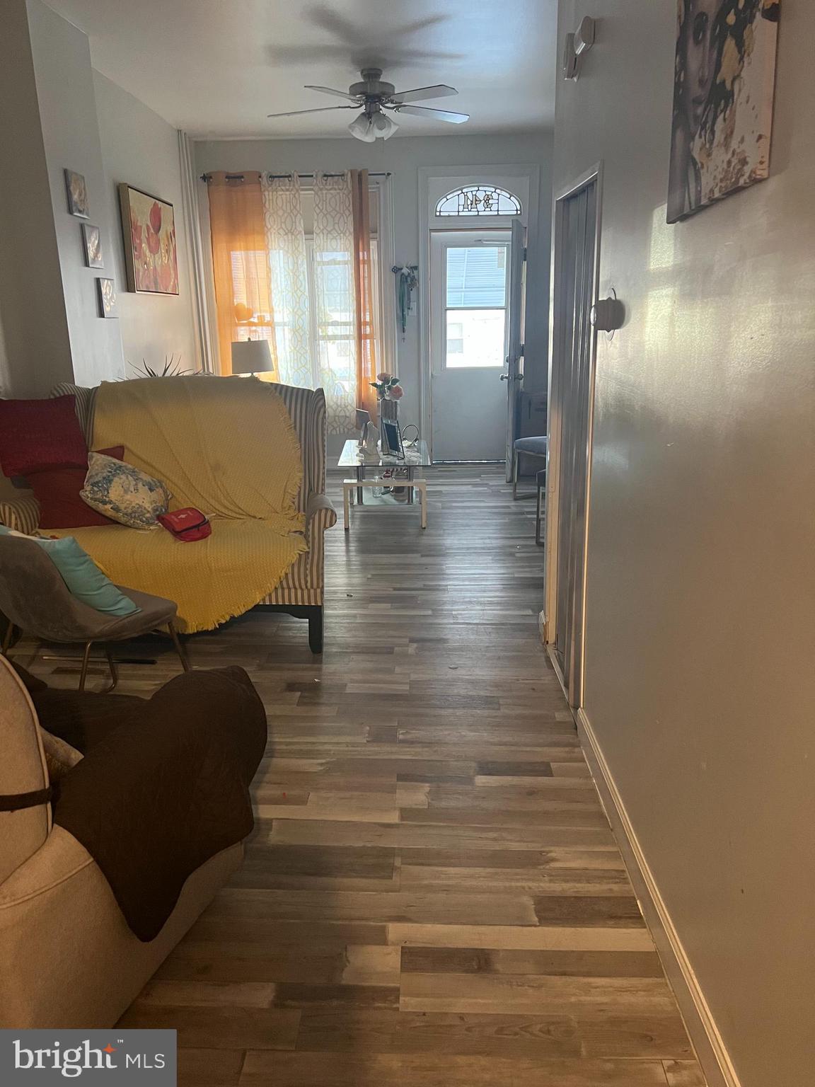 341 South 9th Street Reading, PA 19602 - Photo 3 of 12 a living room with furniture and a wooden floor