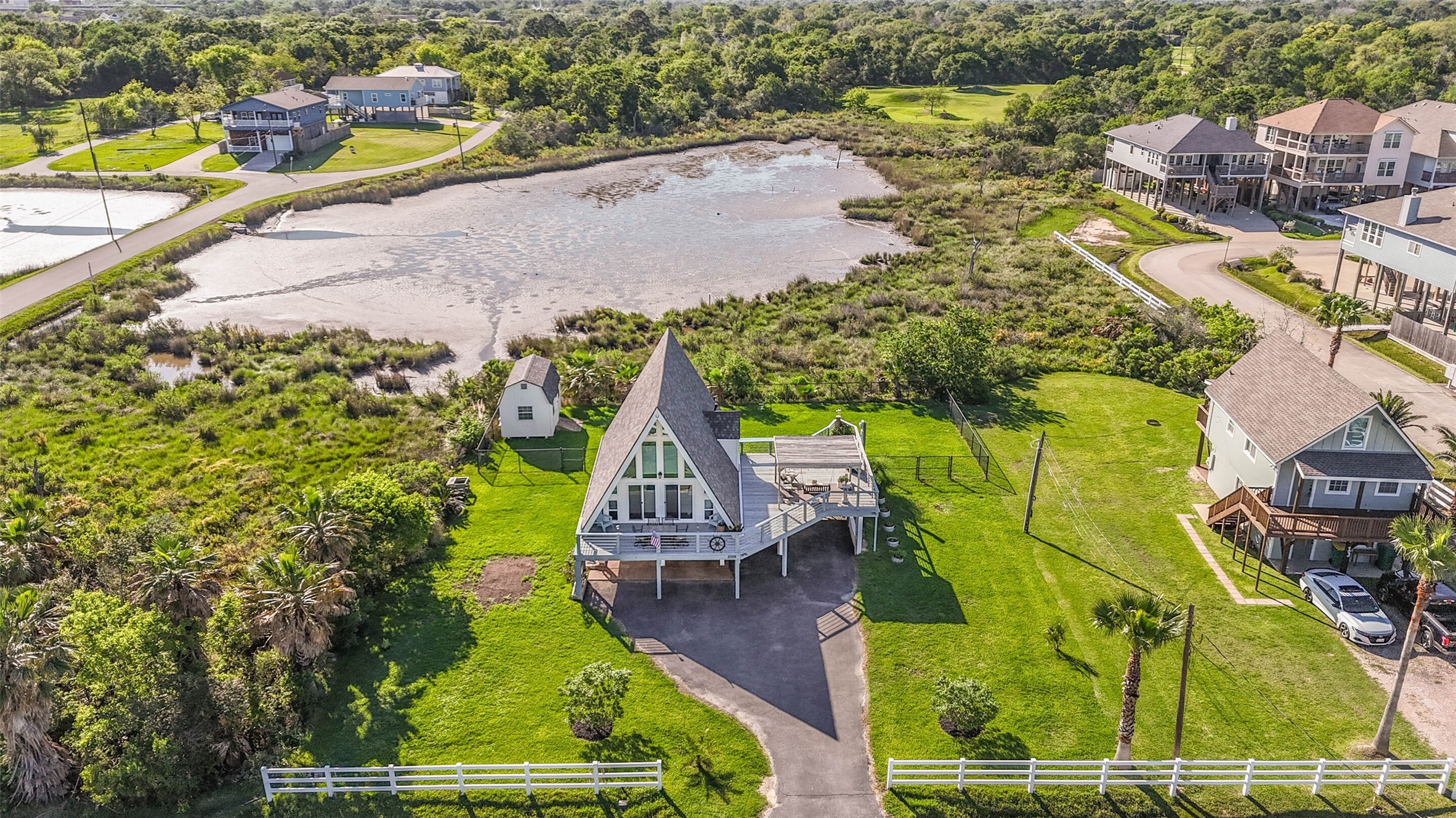2009 Todville Road Seabrook, TX 77586 - Photo 2 of 46 an aerial view of a house with a yard basket ball court and parked