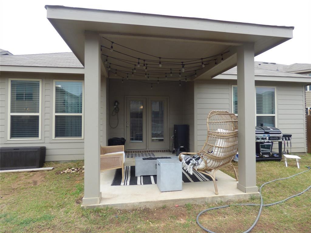 7416 Boat Wind Road Fort Worth, TX 76179 - Photo 11 of 18 a view of a patio with table and chairs