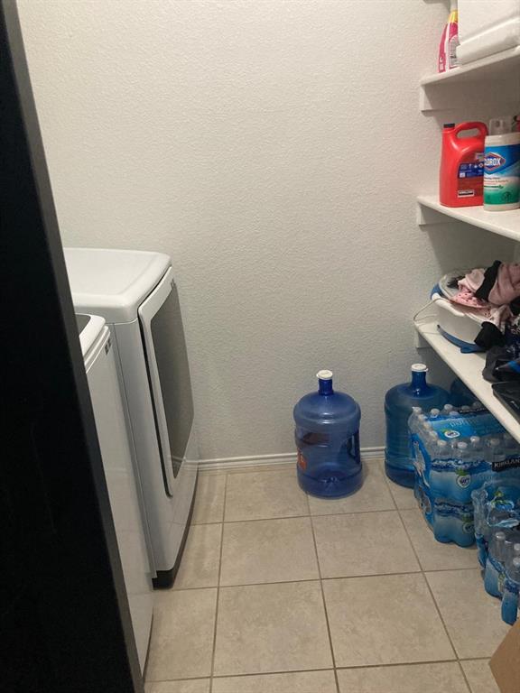 7416 Boat Wind Road Fort Worth, TX 76179 - Photo 14 of 18 a bathroom with a toilet and a sink