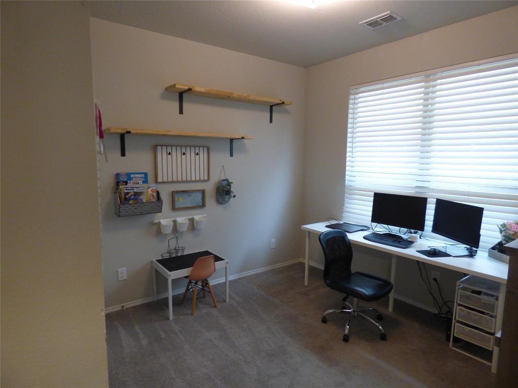 7416 Boat Wind Road Fort Worth, TX 76179 - Photo 7 of 18 a view of a workspace with furniture and a window
