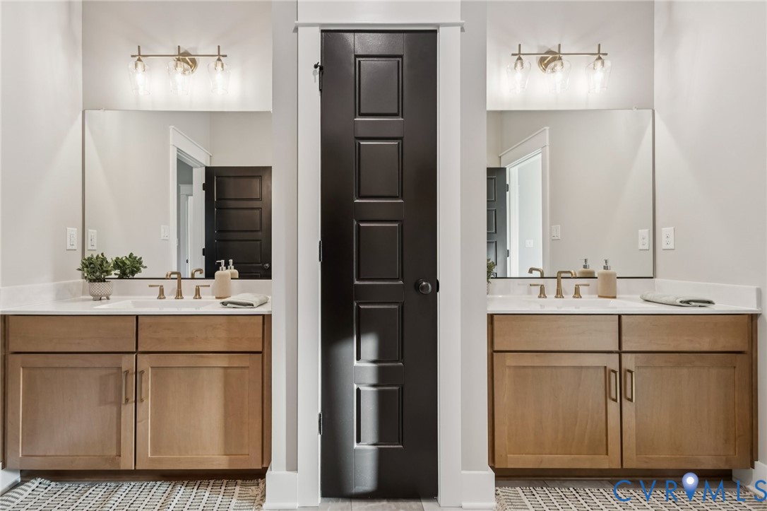 Lot 5 Olivet Church Road New Kent, VA 23124 - Photo 37 of 40 Dual vanity bathroom featuring wood-finish cabinet