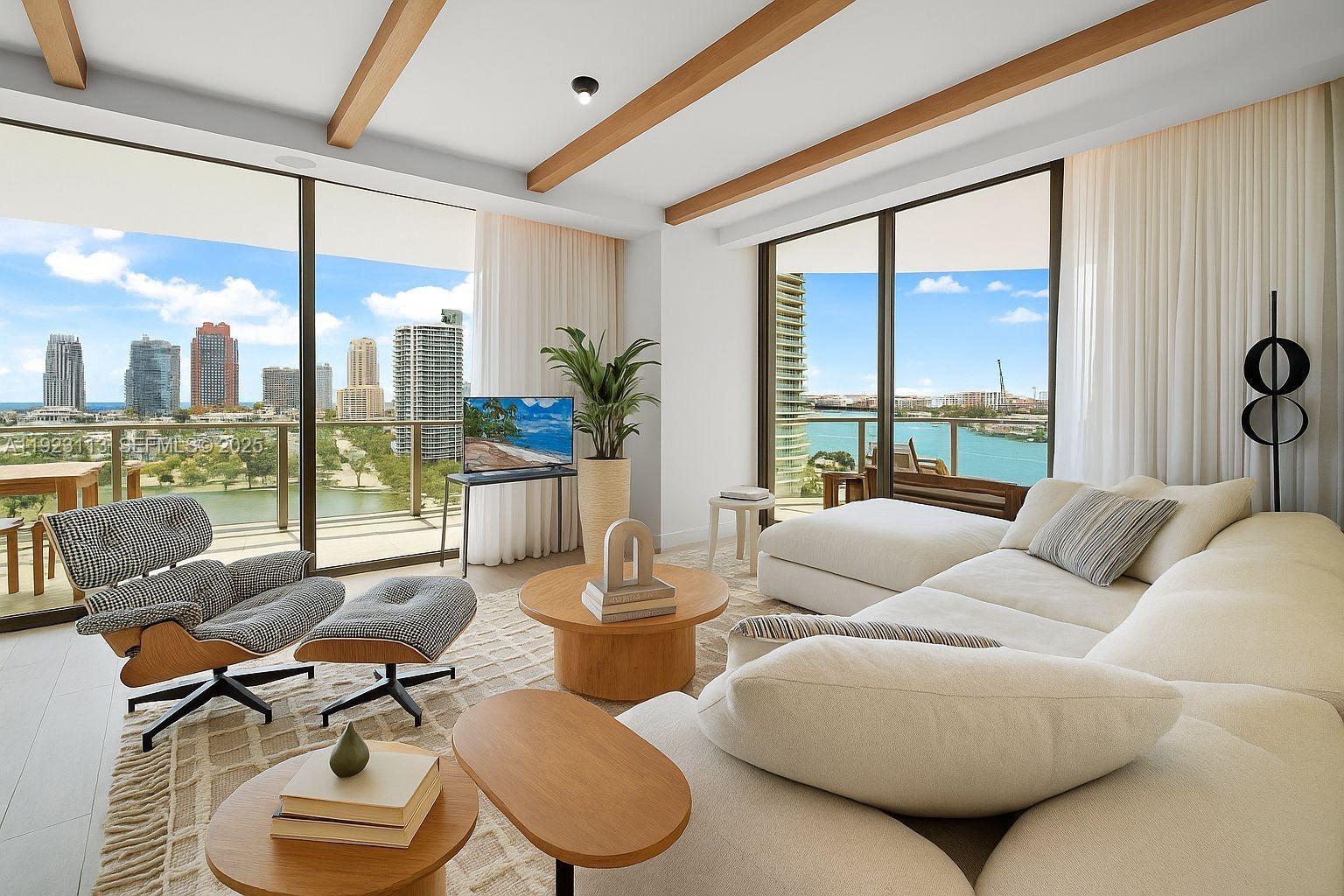 500 Alton Road, Unit 1601 Miami Beach, FL 33139 - Photo 1 of 21 a living room with furniture and a large window