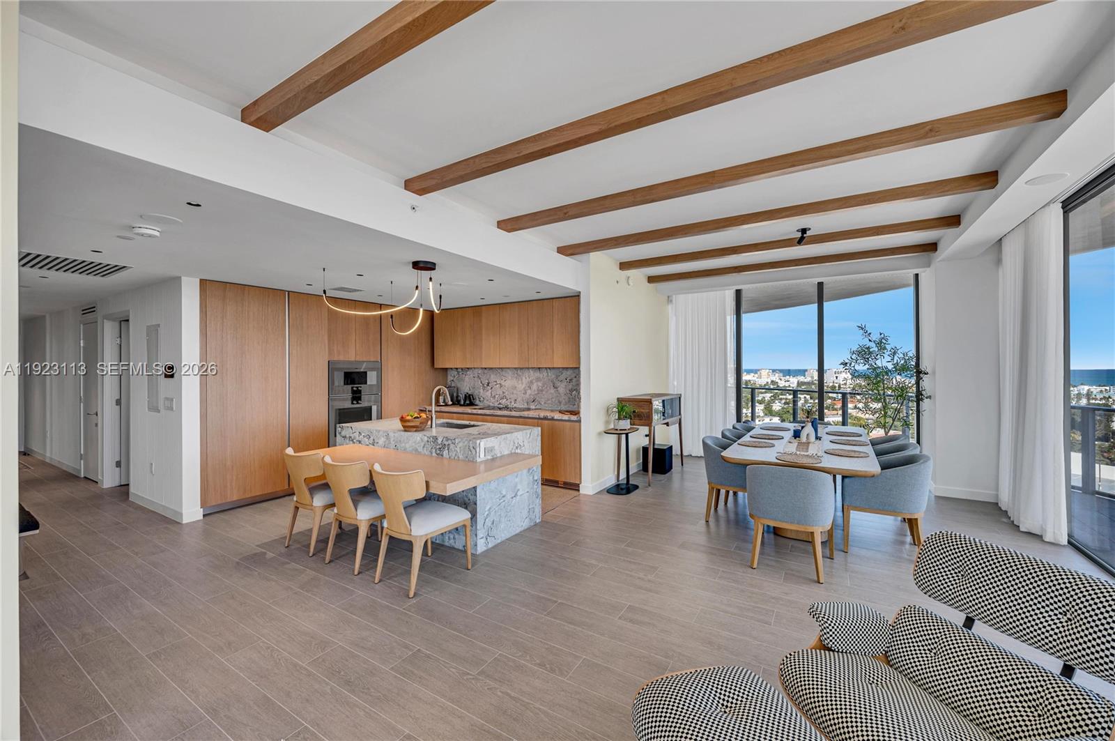 500 Alton Road, Unit 1601 Miami Beach, FL 33139 - Photo 13 of 47 a living room with furniture a large window and stainless steel appliances