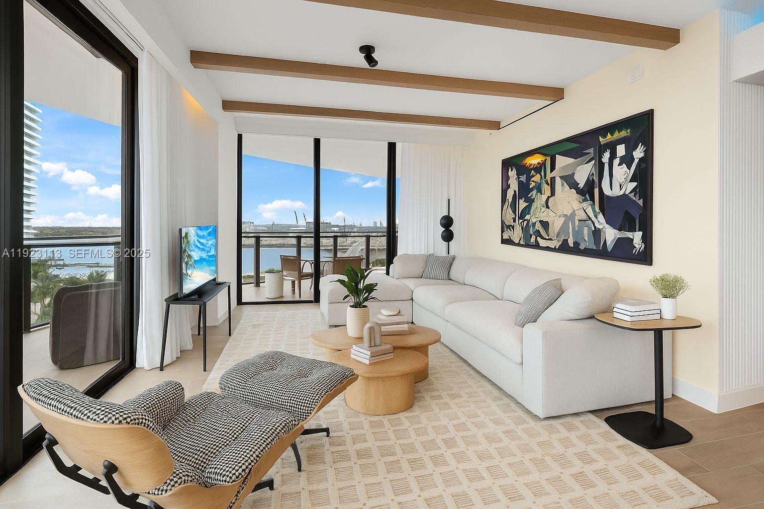 500 Alton Road, Unit 1601 Miami Beach, FL 33139 - Photo 2 of 21 a living room with furniture and a floor to ceiling window