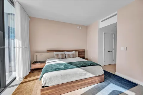 a bedroom with a bed and a desk