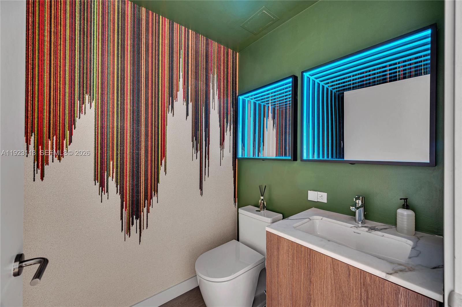 500 Alton Road, Unit 1601 Miami Beach, FL 33139 - Photo 27 of 47 a bathroom with a toilet a sink and mirror