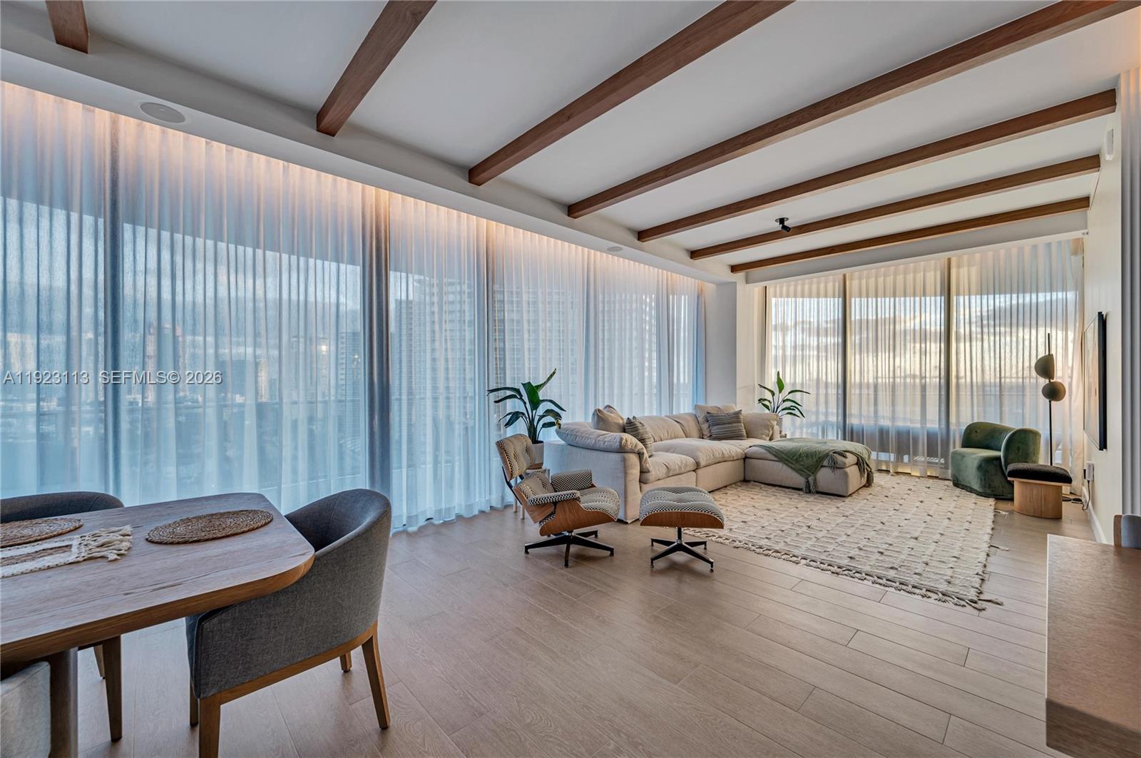 500 Alton Road, Unit 1601 Miami Beach, FL 33139 - Photo 31 of 47 a living room with furniture and floor to ceiling window