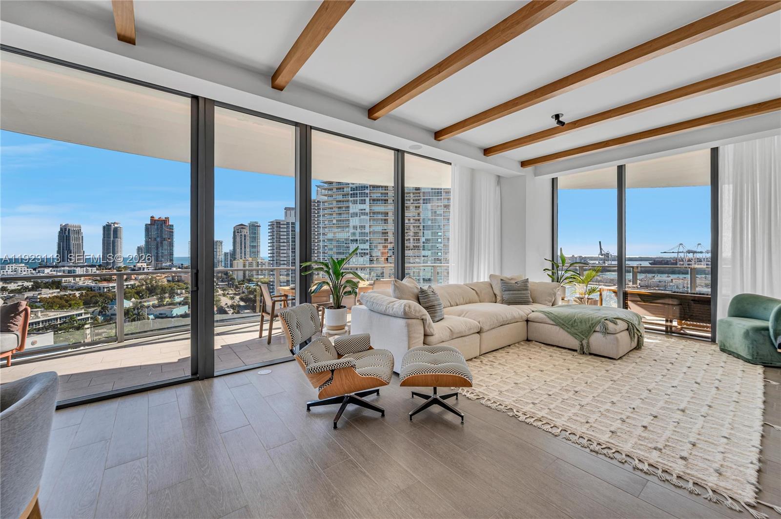500 Alton Road, Unit 1601 Miami Beach, FL 33139 - Photo 4 of 48 a living room with furniture and a floor to ceiling window