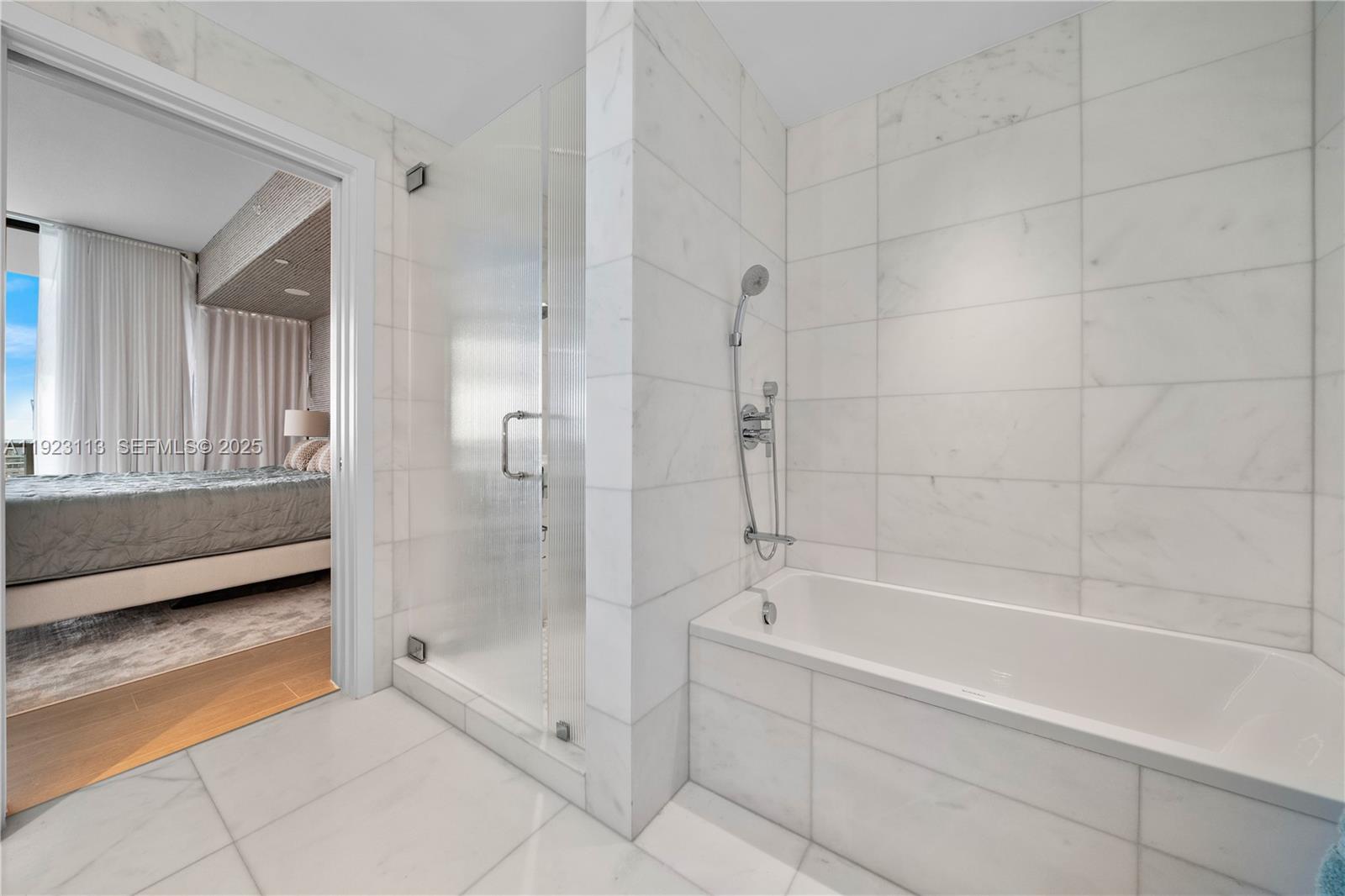 500 Alton Road, Unit 1601 Miami Beach, FL 33139 - Photo 6 of 21 a spacious bathroom with a bathtub and a shower
