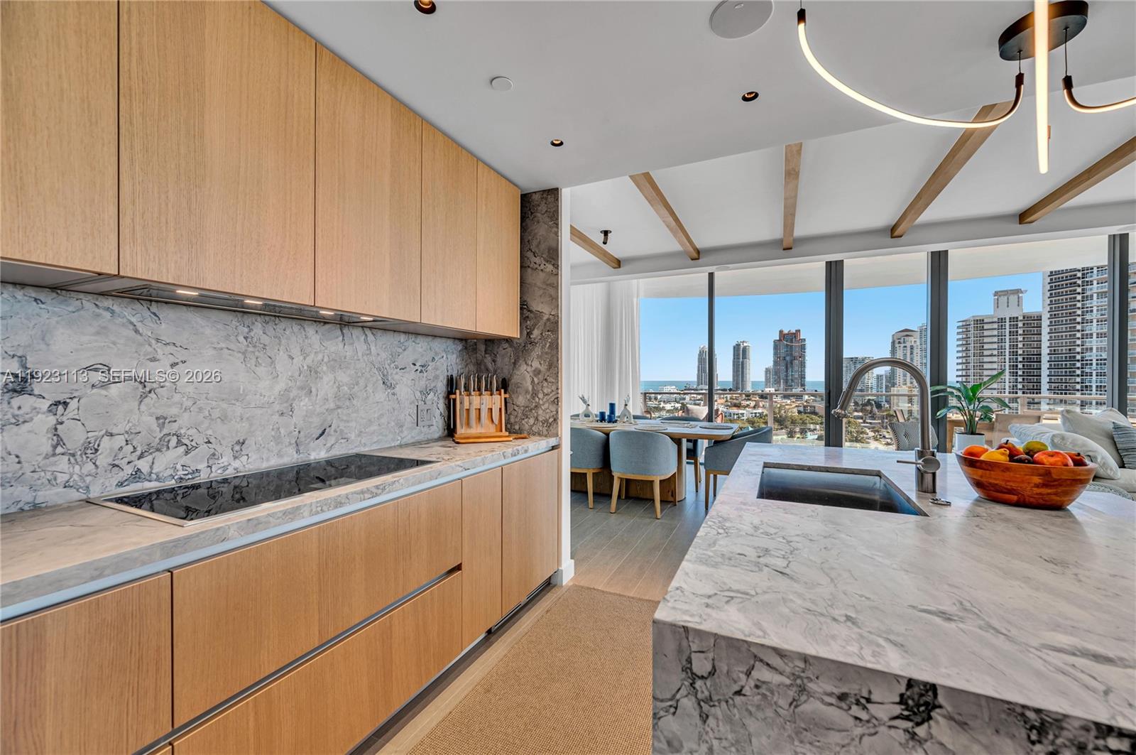 500 Alton Road, Unit 1601 Miami Beach, FL 33139 - Photo 8 of 48 a kitchen with stainless steel appliances granite countertop a sink a stove and a wooden floors