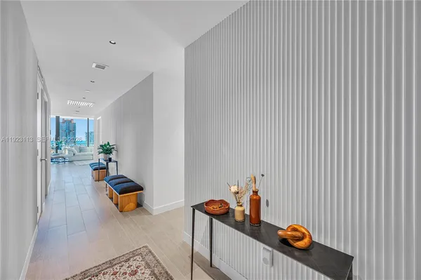 a kitchen with stainless steel appliances granite countertop a sink a stove and a wooden floors